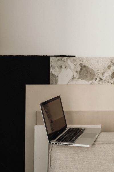 laptop next to marble pieces